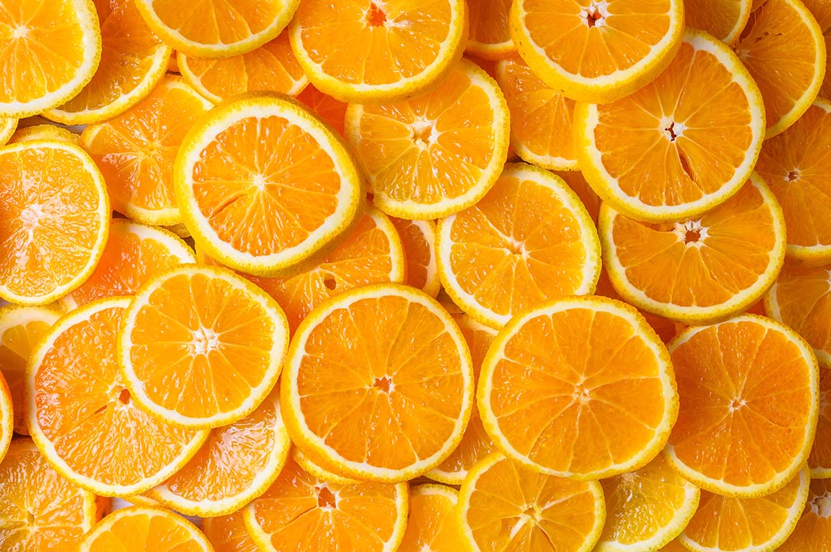 Orange fruit pattern. Healthy food background, directly above.